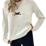White sweater with a black cat design on a white background