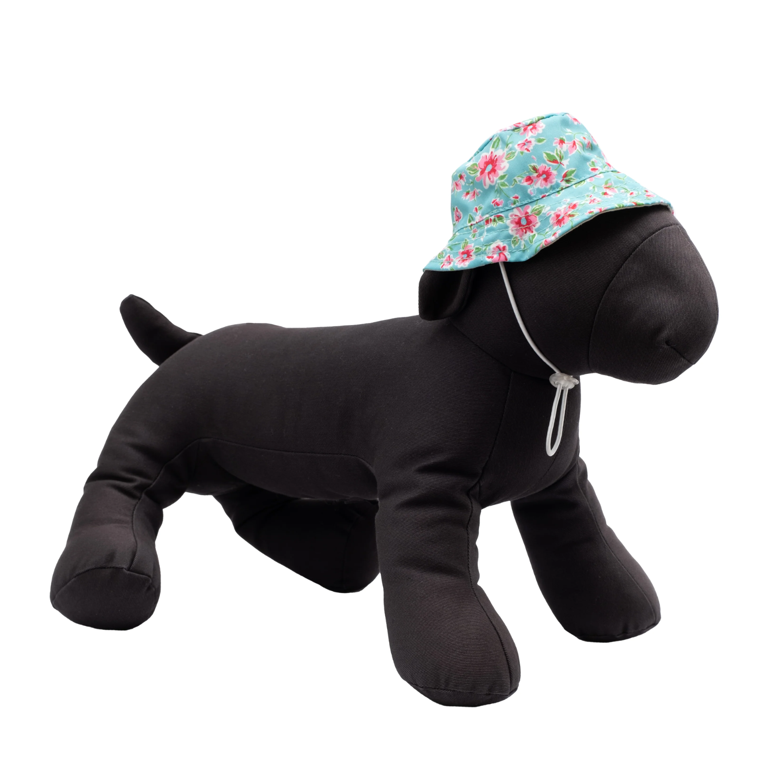 A black plush dog wearing a turquoise floral bucket hat with a white drawstring, shown on a plain white background.