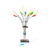 Colorful fishing lures on sticks in a clear vase with a white background