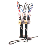 Collection of dog toys on a stand with various leashes and accessories.