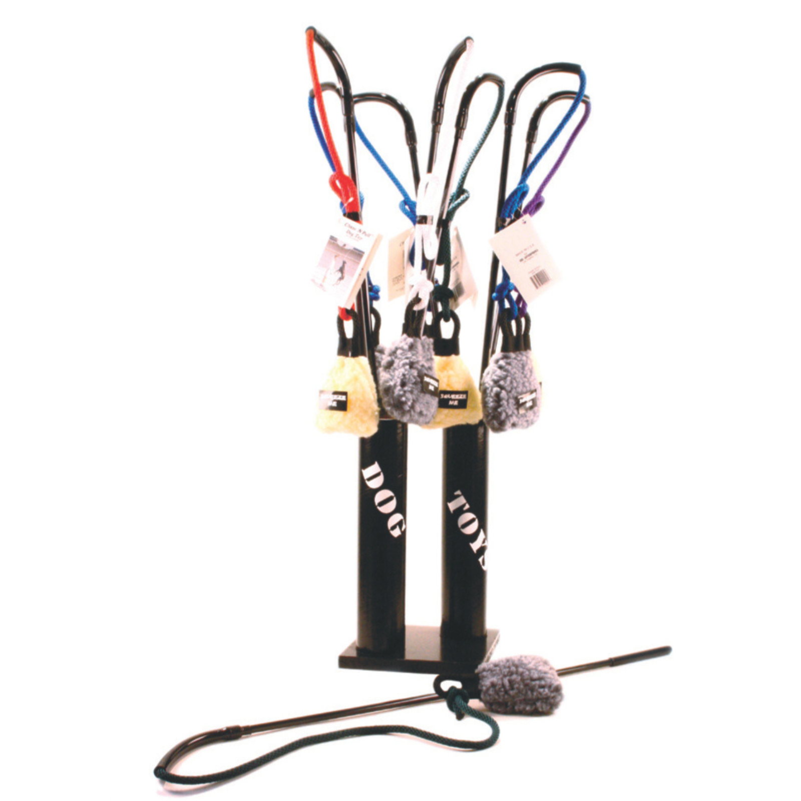 Collection of dog toys on a stand with various leashes and accessories.