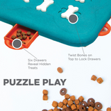 Dog puzzle toy with bones and drawers on a white background
