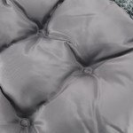 Close-up of a gray cushion with button details