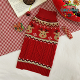 Red dog sweater with reindeer design on a checkered fabric background