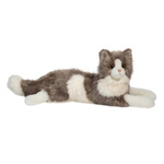 Plush toy cat lying on a white background