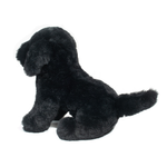 Black plush dog toy on a white background