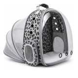 A clear plastic and mesh pet carrier backpack with a gray and black leopard print pattern, shown on a white background.