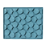 Blue silicone mold with geometric pattern on a white background