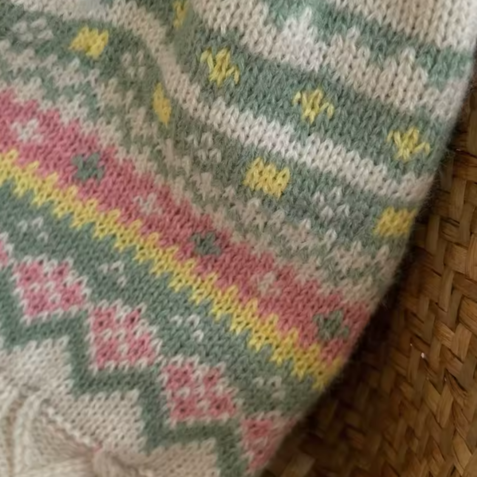 Knitted fabric with a colorful pattern on a woven surface