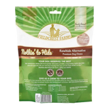 A bag of Field Crest Farms Nothin' to Hide Rawhide Alternative Premium Dog Chews, featuring a green and white package design with a brown band and a dog silhouette logo.