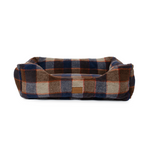 Plaid patterned pet bed on a white background