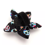 Black hair bow with colorful floral patterns on a white background
