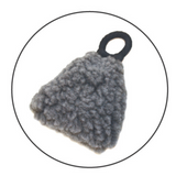 Gray textured object with a black ring on a white background