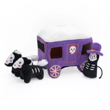 Purple dog toy caravan with two black and white horse toys on a white background