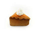 Plush toy resembling a pumpkin pie with whipped cream on a white background