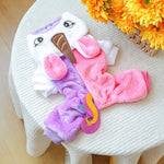 Colorful children's outfit with a hood and pink pants on a white chair.