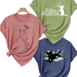 Three t-shirts with cat designs on a white background