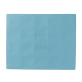 Light blue placemat with 'Fuzzyard Life' branding on a white background