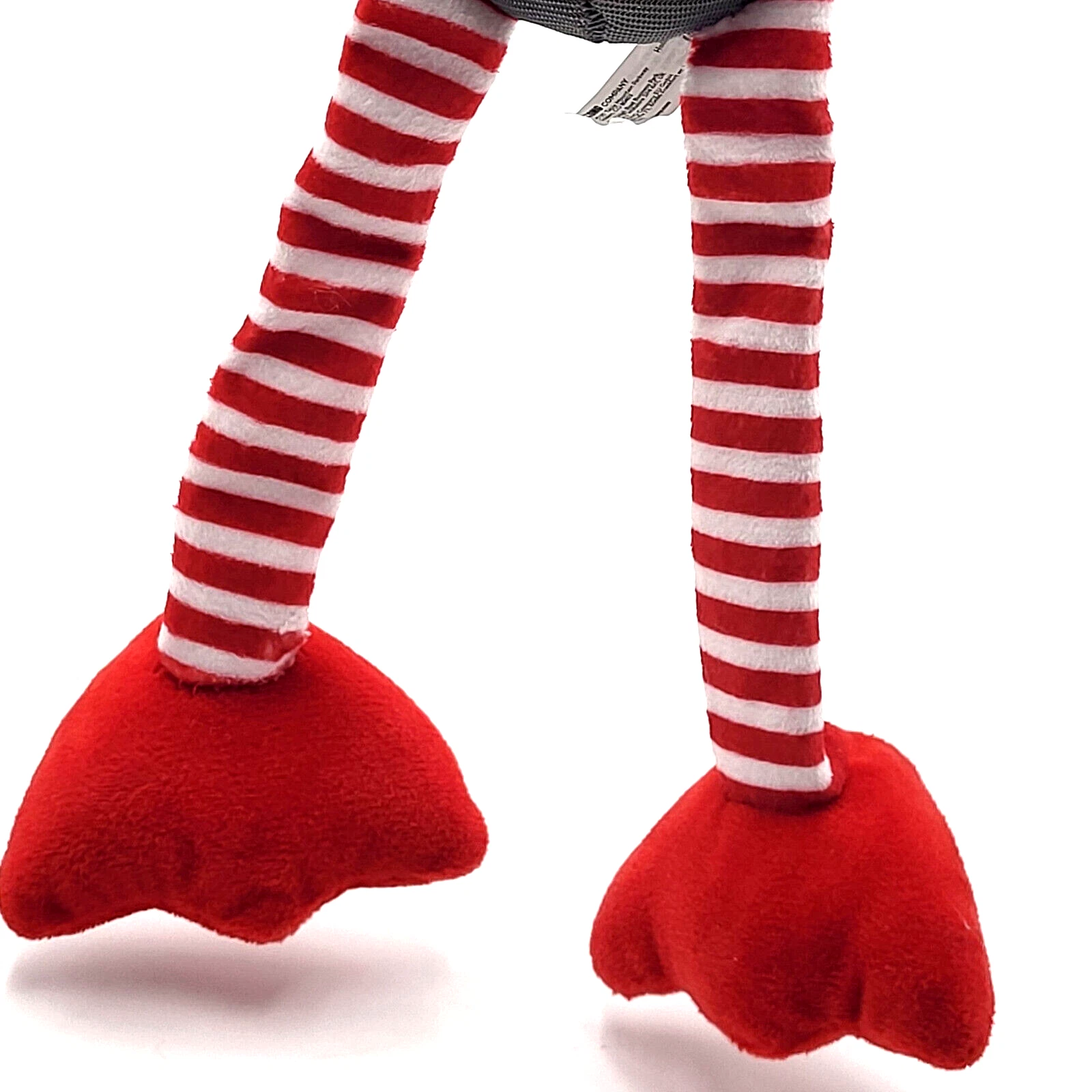 Red and white striped legs with red feet on a white background