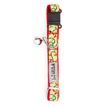 A pet collar with a festive Christmas lights pattern on a light yellow background, featuring red and green lights, a black plastic buckle, and a silver metal ring with a tag that reads 'WRATH CAT'.