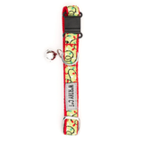 A pet collar with a festive Christmas lights pattern on a light yellow background, featuring red and green lights, a black plastic buckle, and a silver metal ring with a tag that reads 'WRATH CAT'.