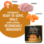 Tiki Dog Taste of Spain pet food can with ingredients like shrimp, chicken, and carrots displayed.