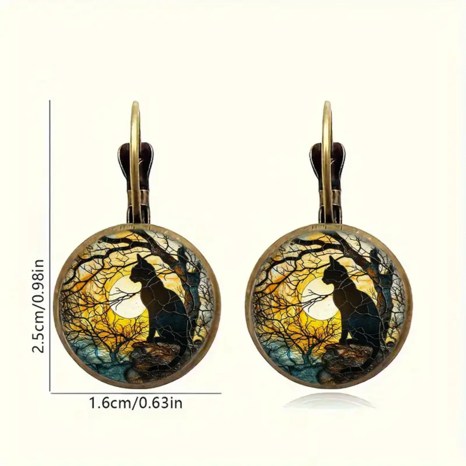 Pair of earrings with cat silhouette design against a moonlit sky, with measurements on a white background.