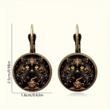 Pair of earrings with cat design on a white background