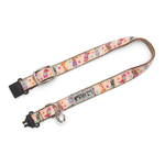 A pet collar with a pastel multicolor pattern of ice cream cones, stars, and stripes on a cream background, featuring a silver metal bell and black plastic hardware.
