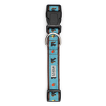 A dog collar with a light blue patterned strap featuring black bear silhouettes, small red and orange leaves, and a silver metal D-ring, shown on a plain white background.