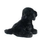 Black plush dog toy on a white background