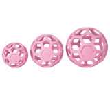 Three pink textured balls of different sizes on a white background