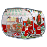 A pop-up dog play tent featuring a festive Christmas camper design with a red and white body, green awning, holiday wreath, Christmas tree, stocking, and a printed dog wearing a Santa hat on the front door.