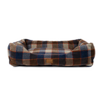 Plaid patterned pet bed on a white background