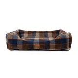 Plaid patterned pet bed on a white background