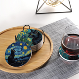 Set of coasters with Van Gogh-inspired designs on a wooden tray with a glass of red wine.