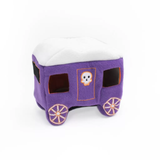 A purple felt horse carriage pet dog toy with a white faux-snow roof, orange stitched trim, and a skull graphic on the front door, set against a plain white background.