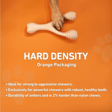 Dog chew toy with a paw on an orange background, featuring text about hard density packaging.