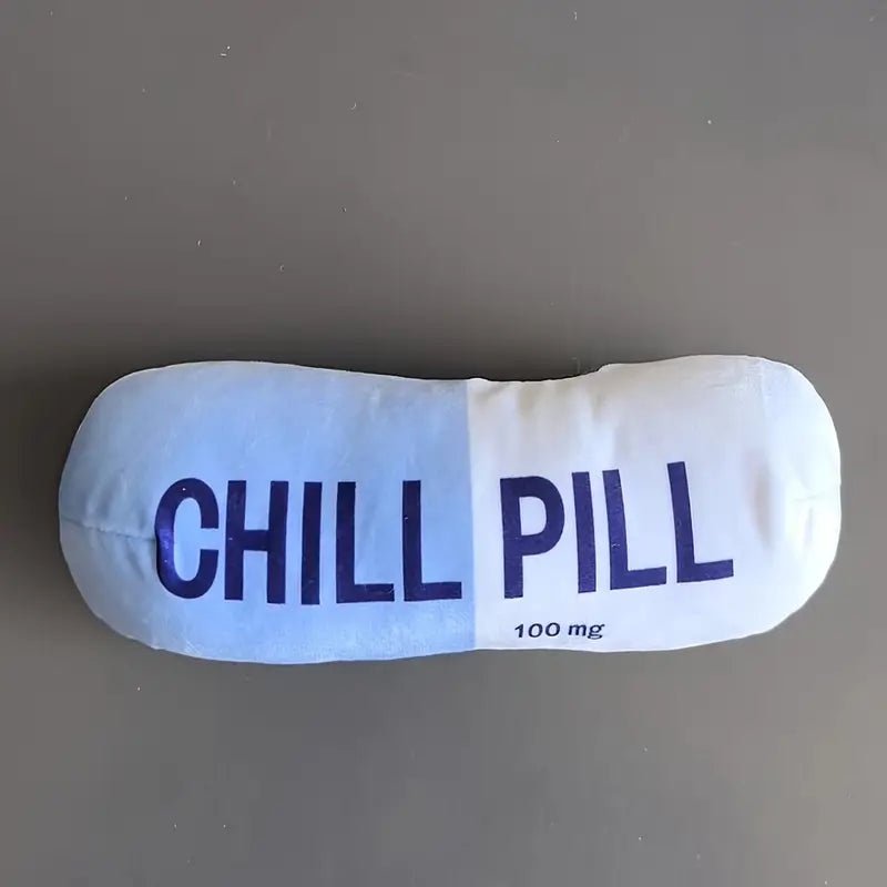 Squeezable pillow with 'CHILL PILL' text on a gray background