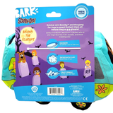 Back of a Bark and Scooby-Doo toy package showing illustrated product features and branding, with a turquoise and purple toy partially visible behind the card.