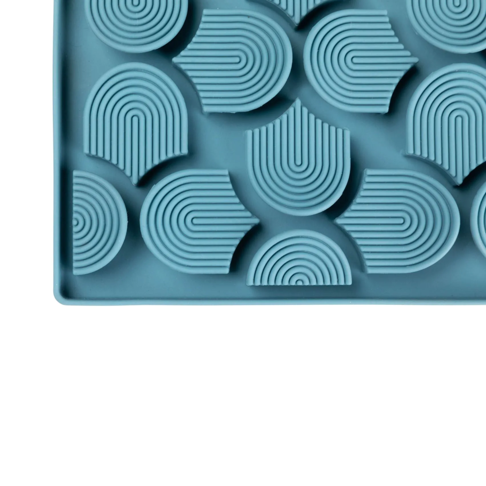 Blue silicone mold with geometric patterns on a white background