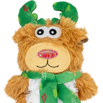 A plush toy reindeer with golden-brown fur, green antlers, a beige stitched face, and a green scarf, shown against a plain white background.