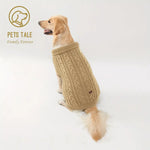 Dog wearing a beige knitted sweater on a white background with 'Pets Tale' branding.