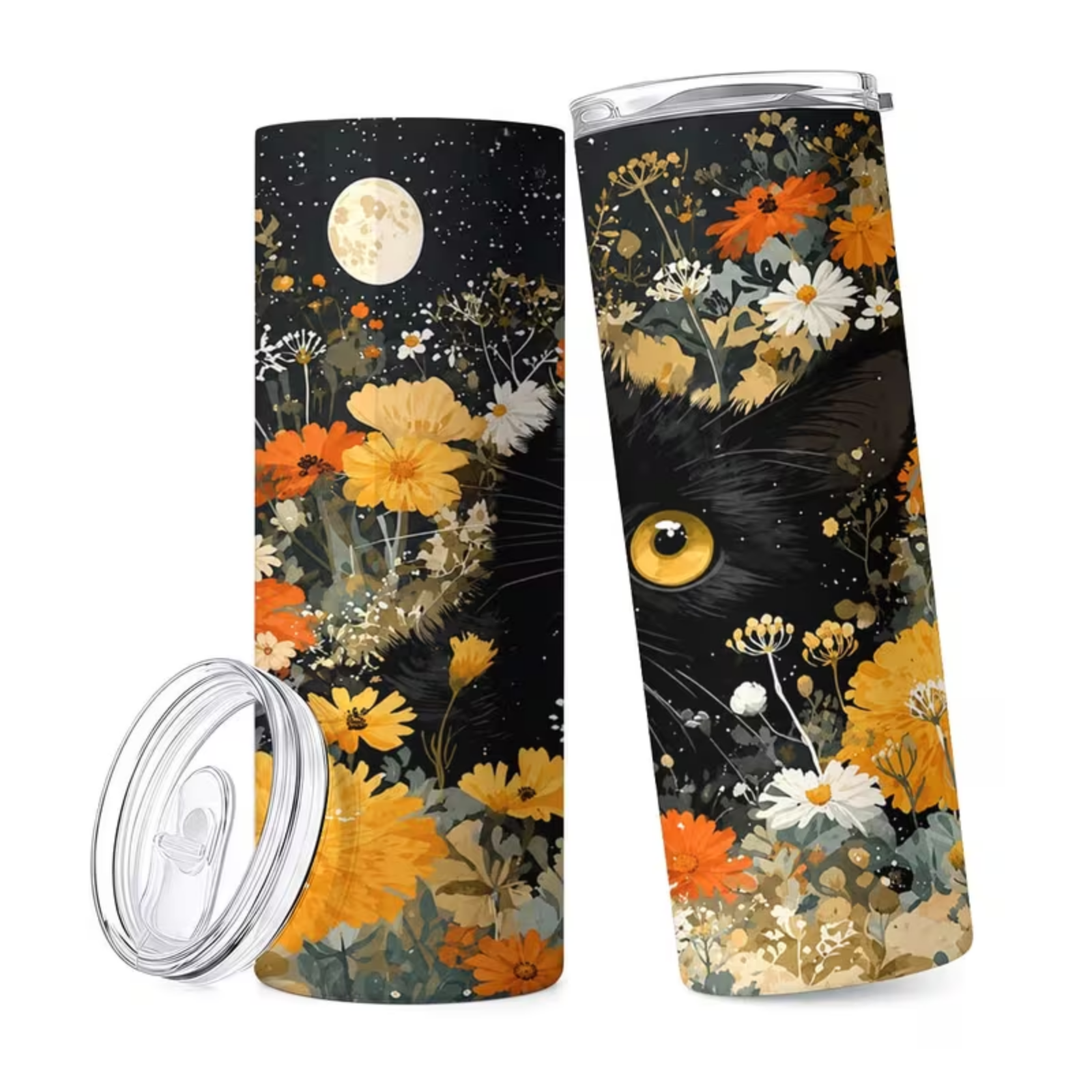 A tall insulated tumbler shown from two angles on a white background, with a clear lid placed beside it. The tumbler has a dark floral-and-cat design: black background with orange, yellow, white, and muted green flowers, plus a large cat eye and whisker illustration.