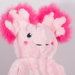 Close-up of a pink plush toy with fluffy pink ears on a gray background