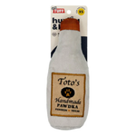 Dog toy shaped like a bottle labeled 'Toto's Handmade Pawdka' with packaging on a white background
