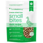 A bag of Small Batch Dog freeze-dried raw duck recipe 'small bites' dog food. The packaging is white and green with a green line drawing of a duck, text detailing the ingredients, and a clear window showing the freeze-dried duck pieces inside.