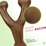 Dog chew toy flavored with real bacon, close-up of texture, and brand name on a light green background.