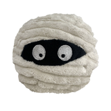 A round plush cushion shaped like a mummy, wrapped in textured off-white fabric with a black embroidered eye patch and two large white embroidered eyes with black pupils, shown on a plain white background.