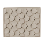 Beige ceramic tray with decorative pattern on a white background